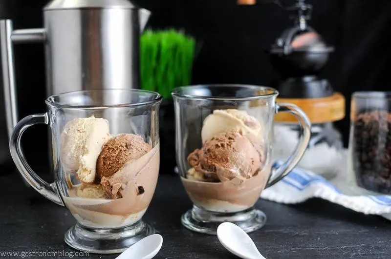 Gelato in clear mugs for affogato with a french press and coffee grinder in the background with white ceramic spoons