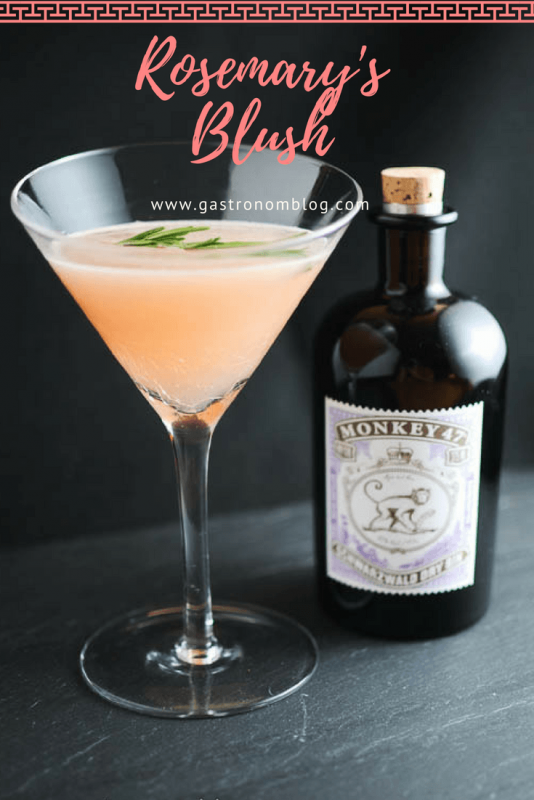 Rosemary's Blush - gin and grapefruit cocktail in a martini glass, gin bottle behind