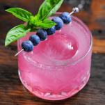 Pink cocktail with blueberries