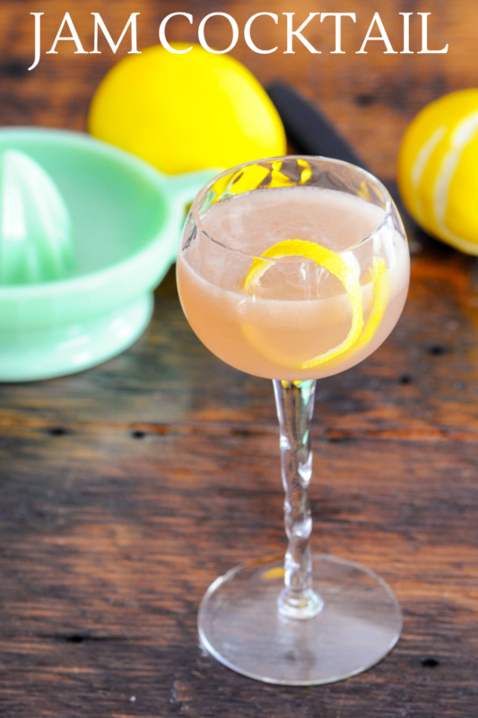 Pink cocktail in coupe with lemon peel