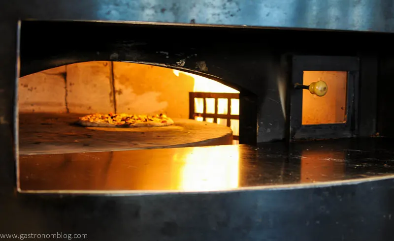 View of pizza baking in oven