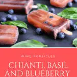 Wine Popsicles on a slate with blueberries and basil leaves