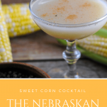 The Nebraskan Cocktail - Yellow corn cocktail in coupe, cobs of corn behind