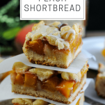 Bourbon Peach Shortbread Bars in a stack with parchment between