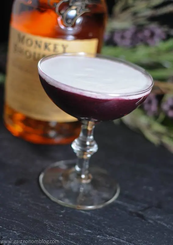 Black Scot Cocktail in a Coupe, Scotch bottle behind