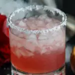 Pink cocktail in rocks glass with salt rim