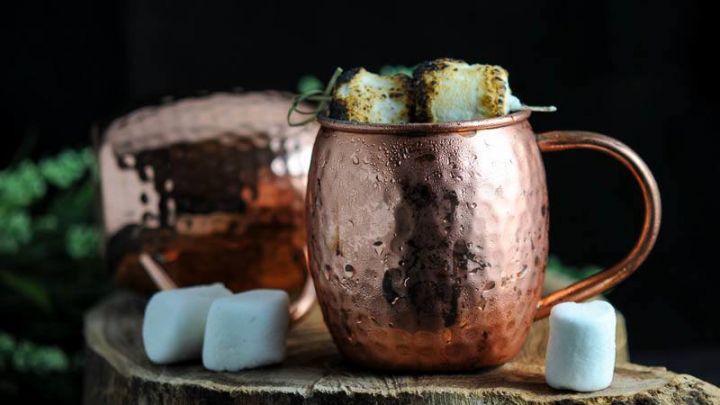 The Campfire Mule - copper mugs on wooden chunk, burnt marshmallows on top. Marshmallows on wood too