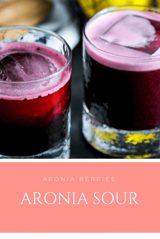 red Aronia Whiskey Sour Cocktails in rocks glasses