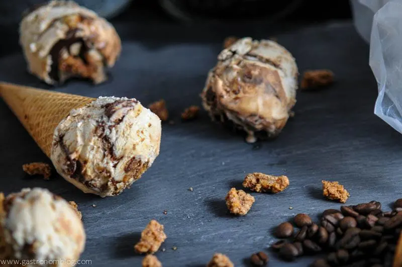 Coffee Stout Fudge Ripple No Churn Ice Cream in cones with bourbon pecans on slate