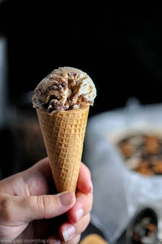 Coffee Stout Fudge Ripple No Churn Ice Cream in a cone, hand holding