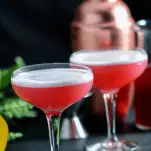 Pink cocktails in coupes with white foam