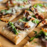 Triangle pieces of flatbreads with bacon, blue cheese and asparagus