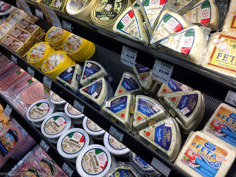 Cheeses to pick from in display at grocery store