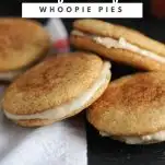 Snickerdoodle Pumpkin Spice Whoopie Pies with Amaretto Cream in pile on white napkin