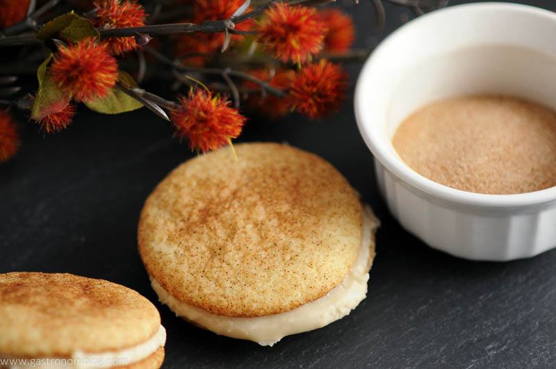 Pumpkin Spice Snickerdoodle Whoopie Pies, flowers and cinnamon sugar in white bowl