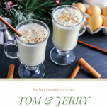 Tom and Jerry Brandy Cocktails, white frothy cocktails in glass mugs, cinnamon sticks and wooden spoons. Eggs, evergreen and white jar behind