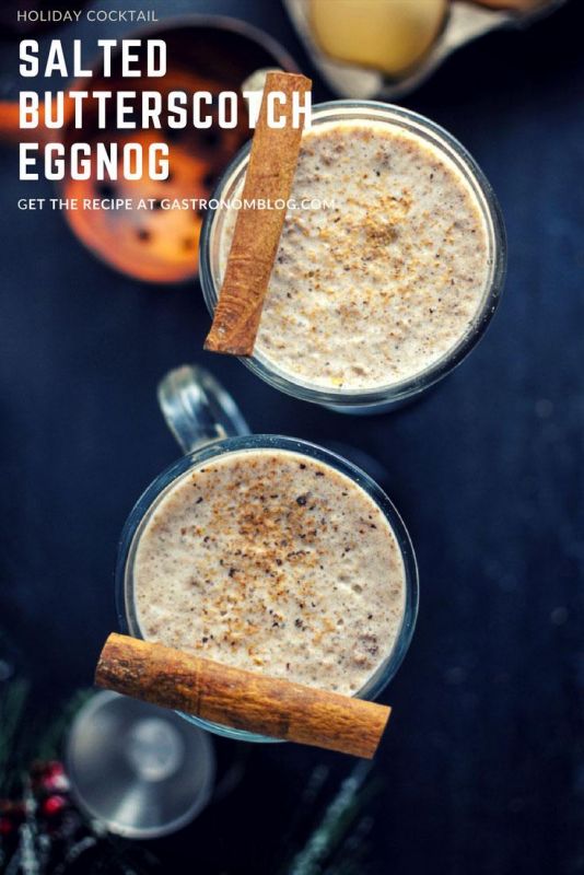 Salted Bourbon Butterscotch Eggnog top shot in glass mugs, cinnamon sticks on top
