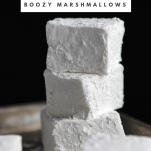 Peppermint Mocha Boozy Marshmallows in a tall white stack on black background