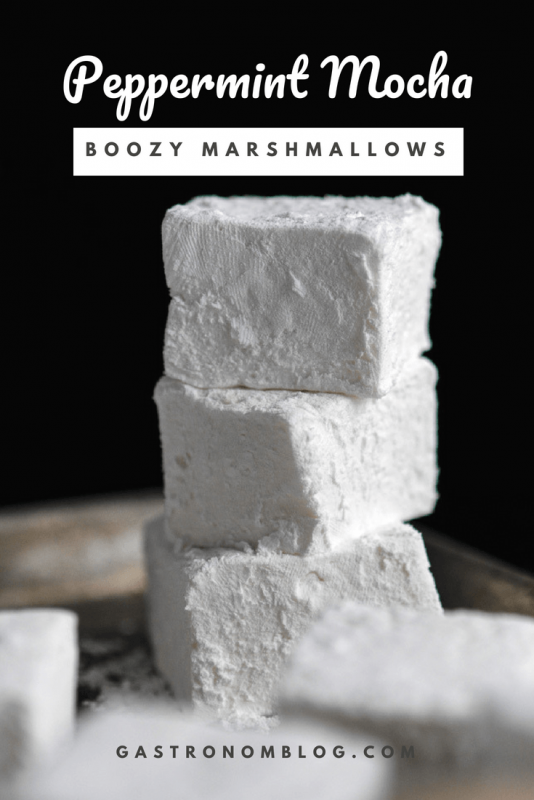 Peppermint Mocha Boozy Marshmallows in a stack against a black background