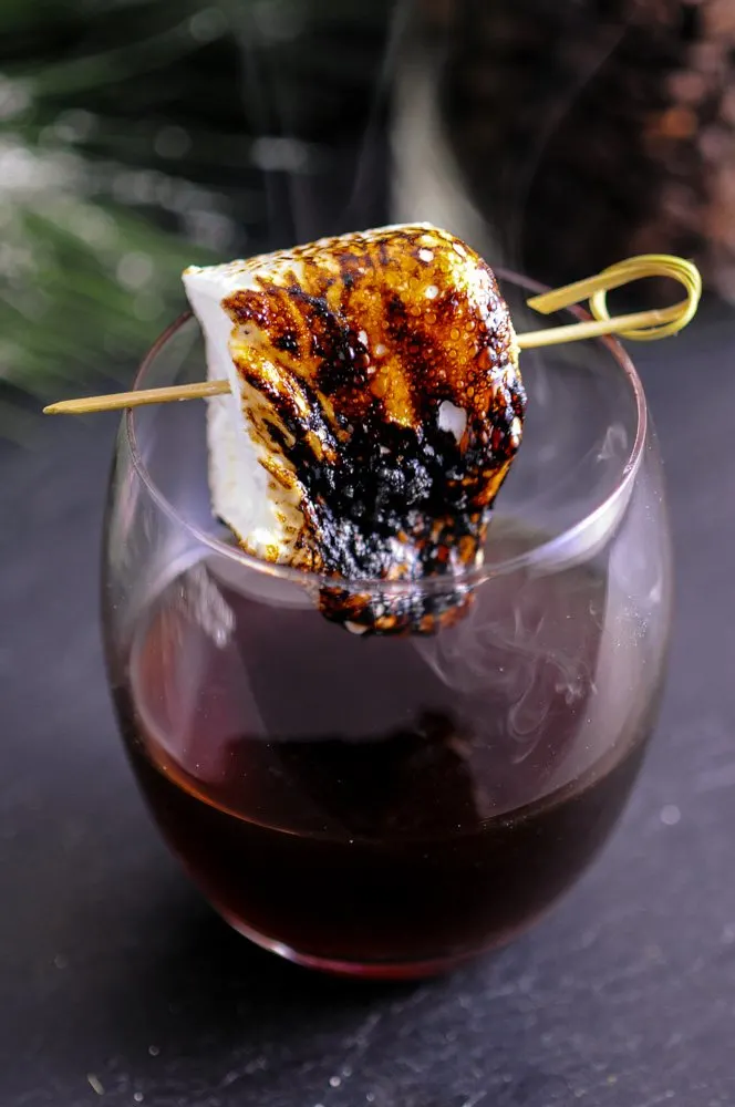 cold brew recipe cocktail, toasted marshmallow in glass, melting browned marshmallows on cocktail pick