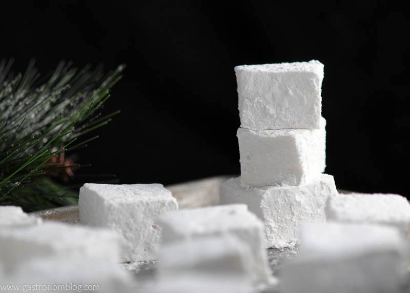 white Peppermint Vodka and Kahlua Mocha Marshmallows in a stack on a black background