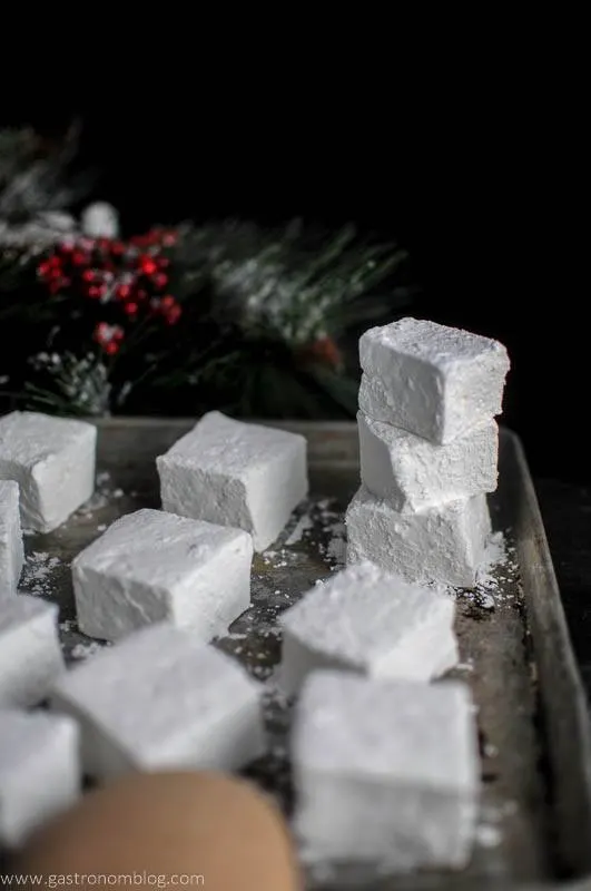 Peppermint Vodka and Kahlua Mocha Marshmallows - white marshmallows in a small stack and on cookie sheet