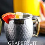 Cocktail in silver mug with grapefruit and ginger