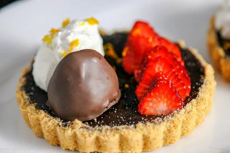 Chocolate Bourbon Tart with Strawberries on white plate