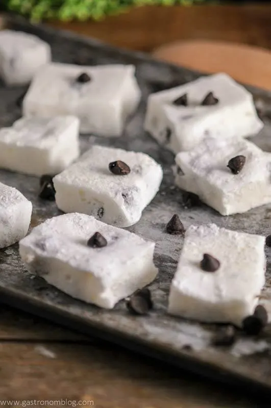 Chocolate Chip Boozy Marshmallows, with chocolate chips on cookie sheet
