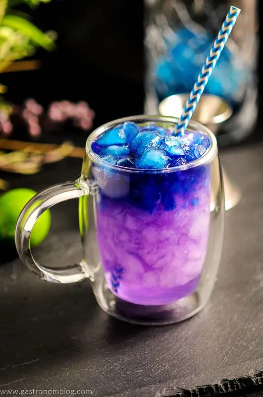 Galaxy Magic Mule Cocktail - purple and blue cocktail in clear mug with blue straw