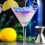 Blue ice on top of white ice in martini glass, lavender sprigs