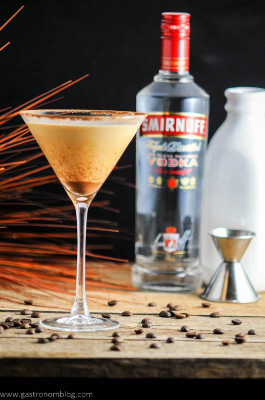 Prettay Prettay Prettay Good Latte Martini with Smirnoff Vokda in martini glass. Jigger, vodka bottle and milk bottle in background