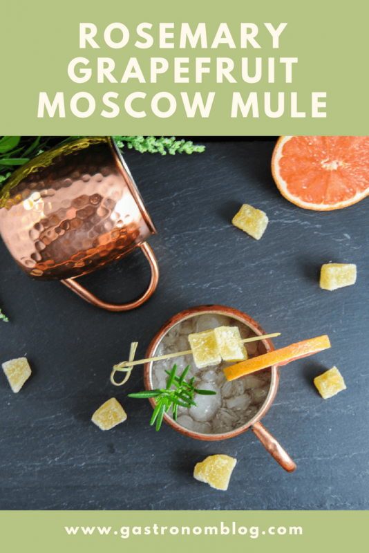 Rosemary Smoked Salt London Mule, top shot of drinks in copper mugs. Candied ginger, grapefruit slices and rosemary on slate