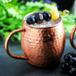 Moscow Mule in copper mug with grapes