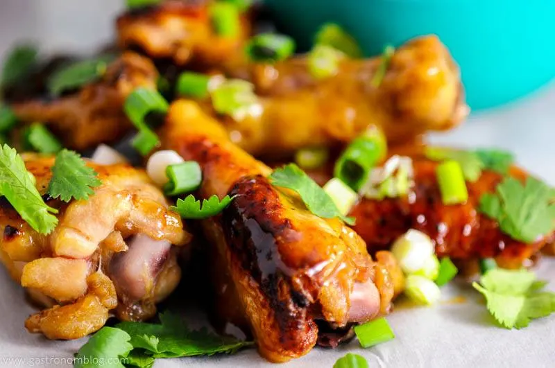 Close up shot of Citrus Asian Chicken wings made with Smirnoff Ice in a pile.
