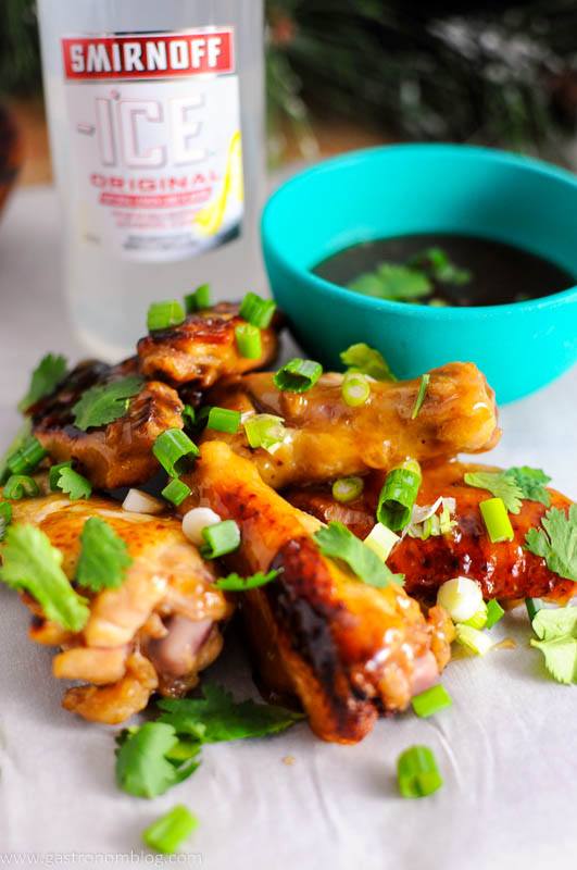 Citrus Asian Chicken Wings with cliantro and green onions with Smirnoff Ice