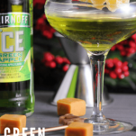 Green cocktail in coupe with sugared ginger