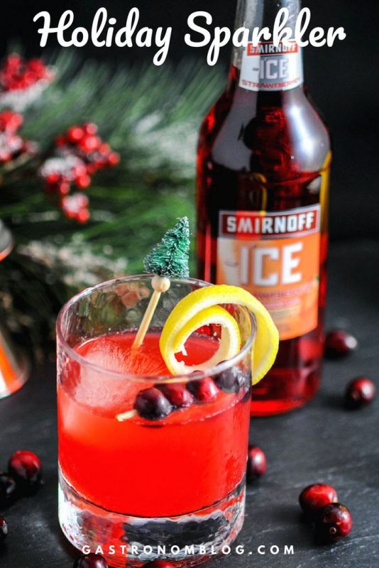 A Holiday Cocktail made with Original and Strawberry Smirnoff Ice. Also cranberry simple syrup, apple cider, and triple sec! A Holiday Cocktail made with Original and Strawberry Smirnoff Ice. Also cranberry simple syrup, apple cider, and triple sec!