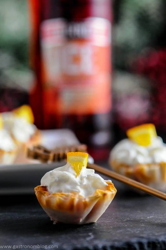 Close up of a holiday mini berry bites with Smirnoff Ice bottle in background