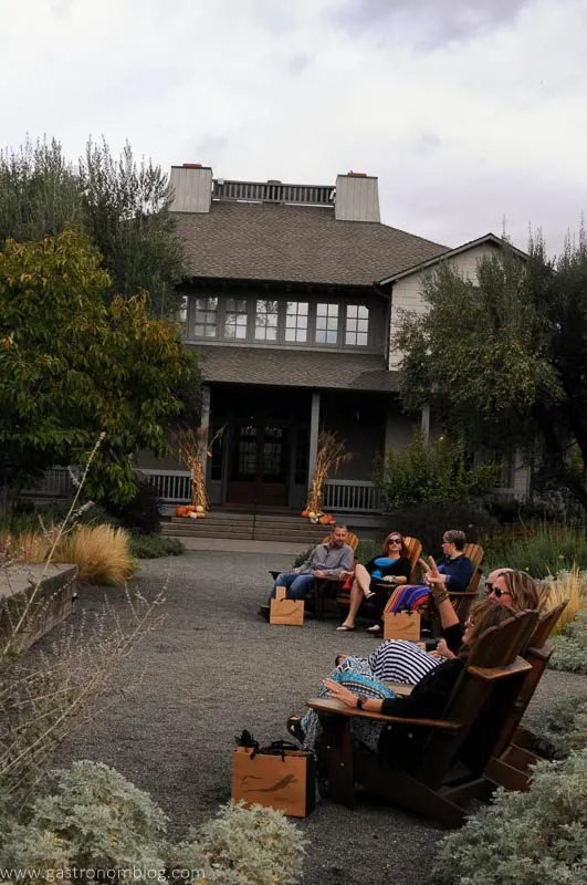 Friends in adirondack chairs at one of the great Napa Valley Wineries
