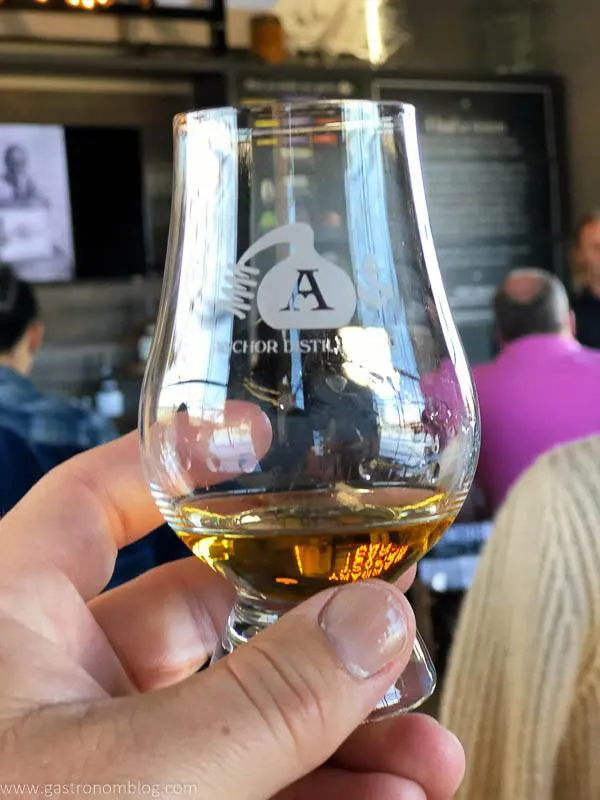 a snifter of whiskey in the Anchor Distilling Tasting room.