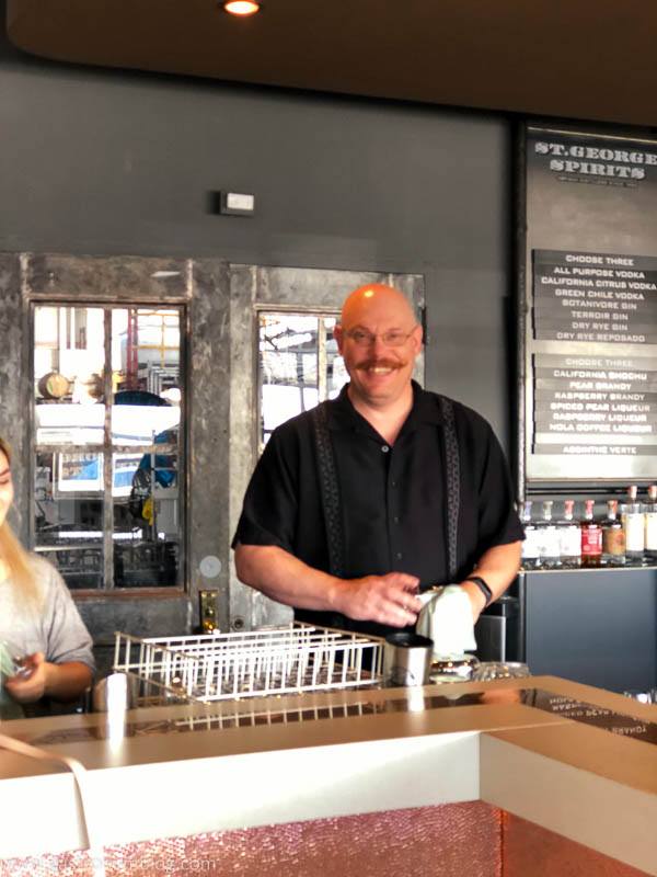 Man behind the counter at St George Spirits Tasting Room.