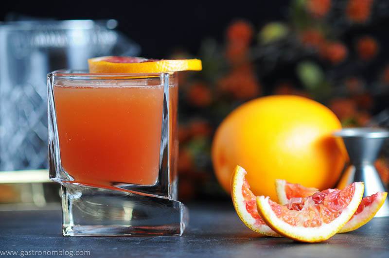 The Blood and Bourbon cocktail in a Carre Whiskey glass from Joy Jolt. Made with Blood orange, bourbon, bitters and lemon.