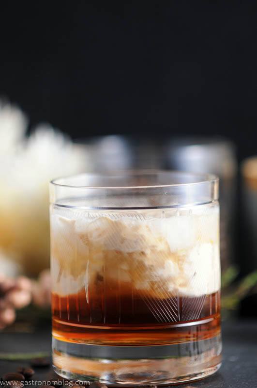 Toasted cream floats on top of a mixture of Kahlua, vodka and chai tea simple syrup, making a Chai Toasted Cream White Russian Cocktail.