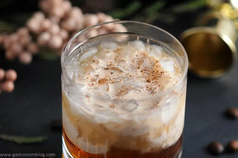 Toasted cream floats on top of a mixture of Kahlua, vodka and chai tea simple syrup, making a Chai Toasted Cream White Russian Cocktail.