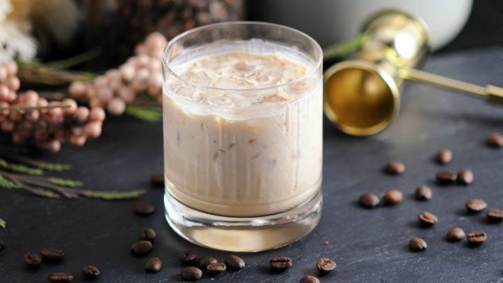 The Chai Toasted Cream White Russian, fully mixed to create this lovely white cocktail in a rocks glass, served on the rocks.