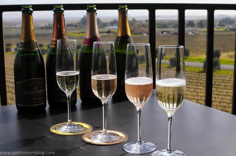Four champange flutes filled with varieties of Gloria Ferrer Sparkling wine.