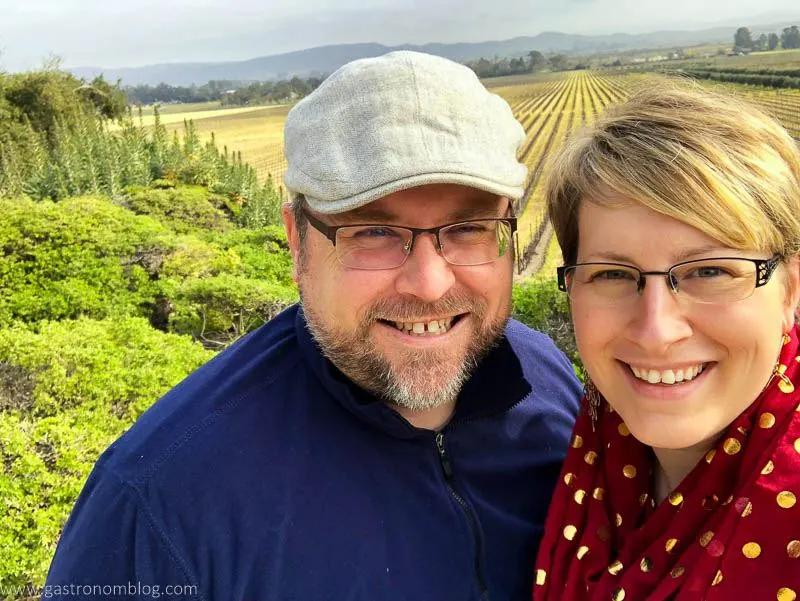A selfie of a man and woman in front of the Sonoma Valley from the overlook at the Gloria Ferrer Caves and Vineyards in Sonoma California.