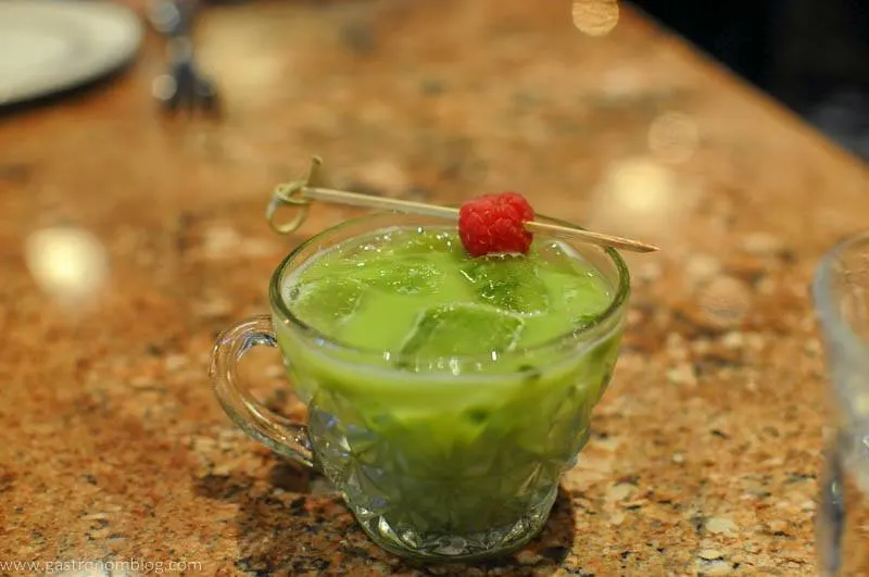 green Matcha cocktail at Le Boullion in Omaha, Nebraska, raspberry on cocktail pick