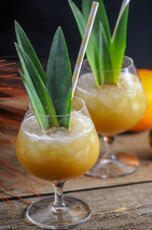 Coconut Rum Painkillers are a great rum, orange juice and pineapple Tiki Cocktail that is perfect for beating the heat!